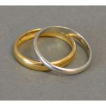 A 22ct. Gold Wedding Band, 3.7 gms, together with a platinum wedding band, 2.