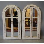 A Pair of Arched Cream Painted Wall Mirrors in the form of Windows,