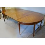 A 19th Century Mahogany Extending Dining Table, comprising two D ends and two extra leaves,