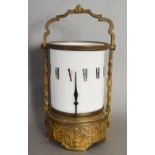 A Brass and Opaque Glass Candle Clock of Cylindrical Form with Roman Numerals,