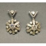 A Pair of White Gold Diamond Set Drop Ear Clips, each set with a central diamond approximately 0.