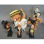 A Royal Doulton Figure 'News Boy' HN Number 2244 together with three Royal Doulton Figures of Dogs,