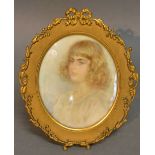 An Edwardian Portrait Miniature of a Girl within Oval Brass Frame,