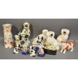 A Pair of Staffordshire Models of Spaniels together with a collection of other similar models
