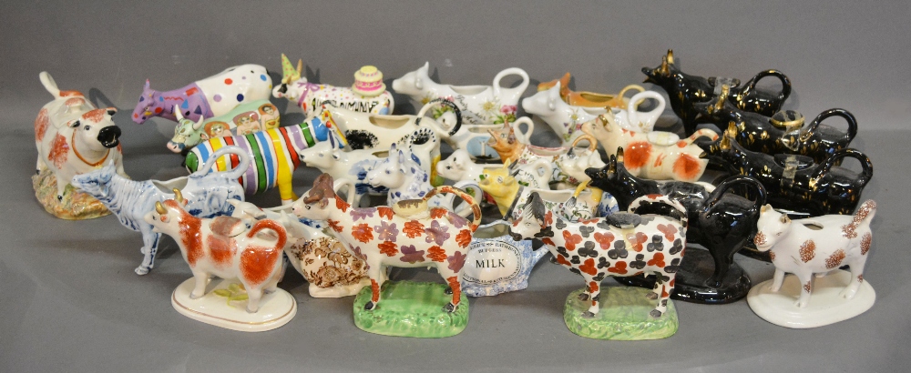 A Large Collection of Cow Creamers