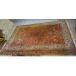 A North West Persian Style Woollen Large Rug with an all over design upon terracotta and blue