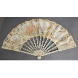 An 18th Century Carved Ivory Fan, hand painted with figures within a cartouche,