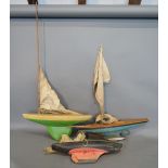 A Painted Wooden Model Pond Yacht together with two other similar Pond Yachts with Masts and Sails