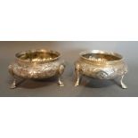 A Pair of Georgian Silver Salts of circular form with engraved decoration on paw feet