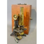 A Brass and Japaned Microscope within a Mahogany Box