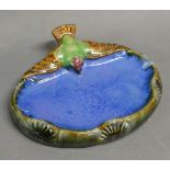 A Doulton Lambeth Pin Tray mounted with a Bird