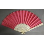 A 19th Century Carved Ivory Fan with Pierced Sticks and Double Satin Rose Coloured Leaf,