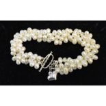 A Multi-Pearl Bracelet set with Silver Bar Clasp and Heart