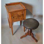 A 19th Century Mahogany Satinwood Crossbanded Bedside Cabinet with a single door raised upon square