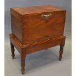 A 19th Century Mahogany Small Cellarette of Rectangular Form raised upon turned legs, 44 cms long,