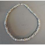 A Keishi Pearl Necklace with silver clas