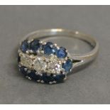 An 18ct. White Gold Sapphire and Diamond