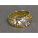 An 18ct. Yellow Gold Diamond Ring set wi