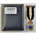 Medal-Civil unknown medal H.M.Silver-a cross pate topped by a red walled cushion-centre disc has