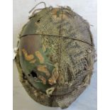 German WWII Pattern Stahlhelm, battle damaged but with traces of camo finish and hessian cover in