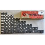 A vintage set of dominos in their original box