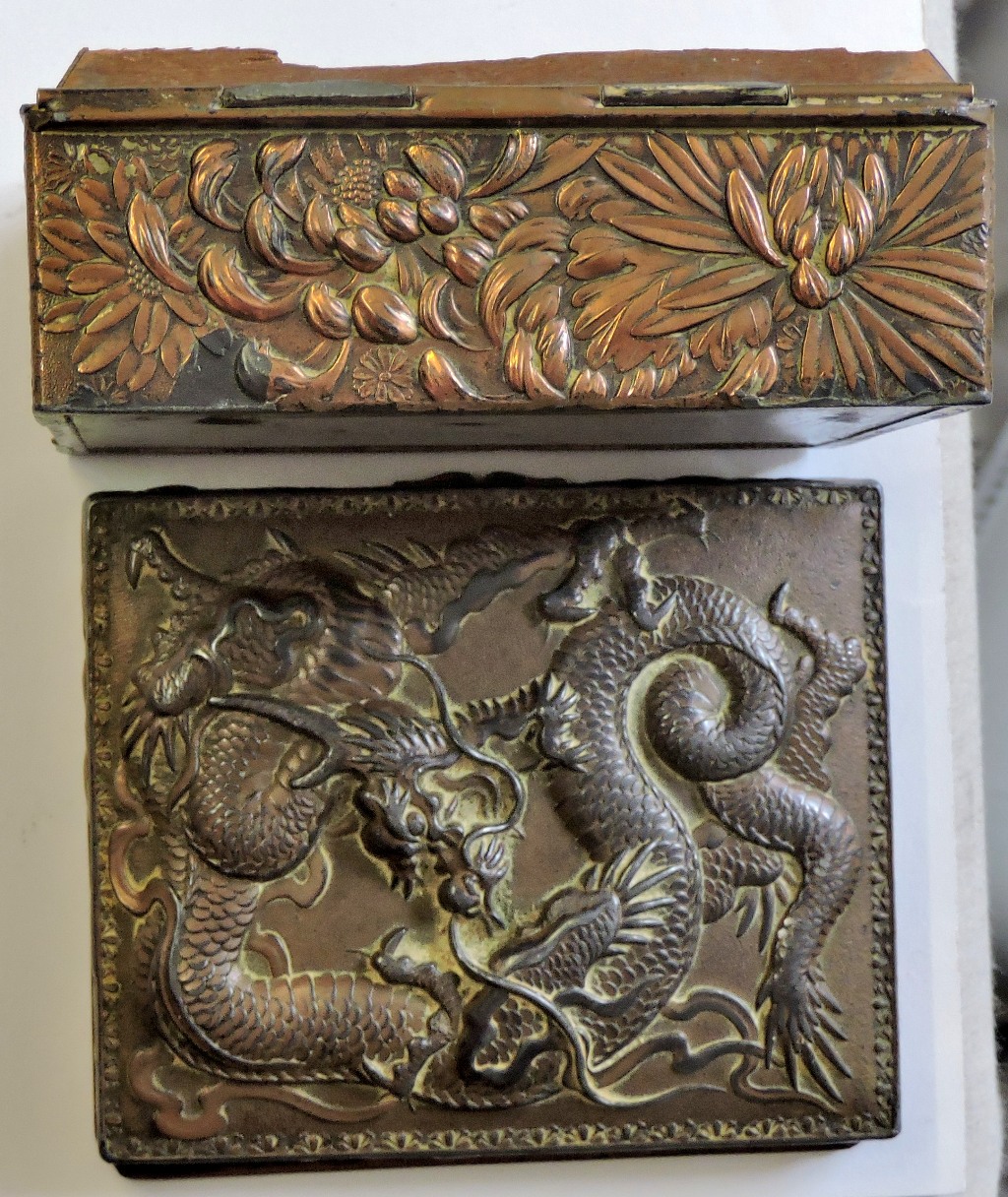 A small box in Chinese style. Made from a copper coated metal with a pine interior for holding