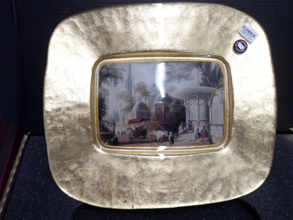 A Glass, Gold Effect Dish -with an illustrated centre - piece featuring a street scene of the old