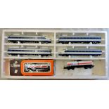 A Lima Electric Train set - boxed (damaged) - two engines, two passenger carriages, two mobilroir