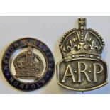 WWII A.R.P. Badge (Silver) with a Norfolk National Reserve badge (Brass and enamel). A scarce pair.