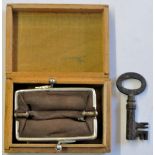 Small Wooden Box containing a key, and a tiny pigskin purse with white metal clasp