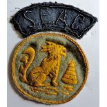 Chindits- a well worn chindit badge and an S.E.A.C shoulder title.