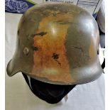 German WWII SS Painted 1935 Pattern Stahlhelm with Army camo paint, stamped inside: 2343-ET64 with a