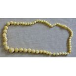An attractive neck-lace Antique beads with chrysanthemums/camellias.