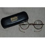 Vintage 1920's tortoiseshell-coloured cellulose covered gilt framed round spectacles, marked Pat.