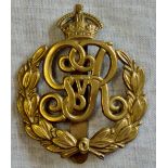 British WWI Military Provost Staff Corps cap badge, early pattern with wreath surrounding the GvR