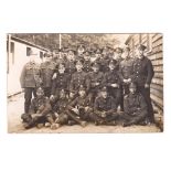 The Queen's Regiment WWI RP Platoon with Bugler outside Barrack hut