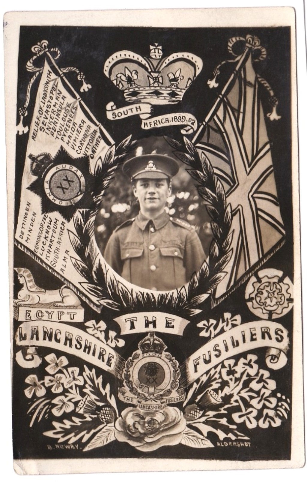 Lancashire Fusiliers WWI RP Regimental postcard with Soldier photo at centre between the Reg