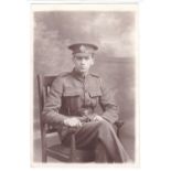 Rifle Bridge WWI-seated soldier photographic postcard - very clear badge