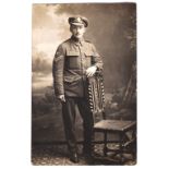 Royal Fusiliers WWI-RP postcard full length portrait of a Corporal - rev '7PI'