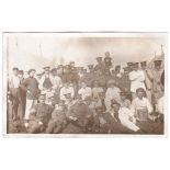 Royal Artillery WWI- Troop photograph,tented back ground, many white jacketd, hard workers