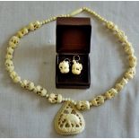 Necklace and earrings carved elephants with jewellers receipt