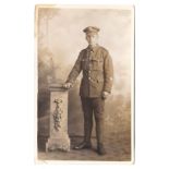 Northumberland Fusiliers WWI Full length uniformed Fusilier standing, 'LG' patch and wound strip