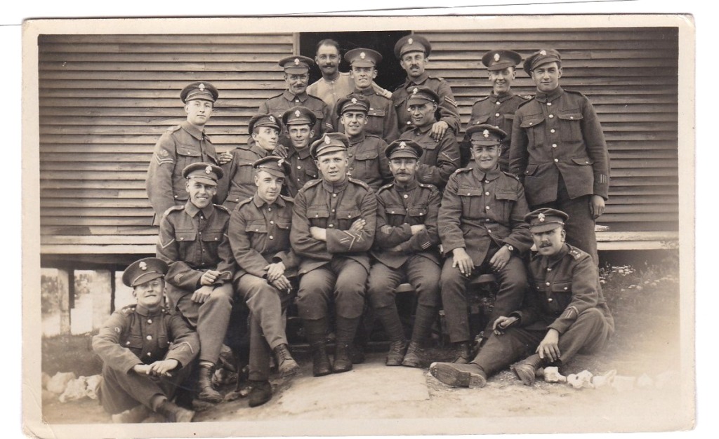 Royal Fusiliers WWI-RP group of (20) out side a hut, cheerful are rashs bunch.
