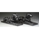 PAIR OF CAST-IRON RECUMBENT RETRIEVER GARDEN ORNAMENTS.