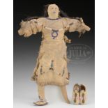 LATE NINETEENTH CENTURY SIOUX DOLL TOGETHER WITH A PAIR OF BEADED DOLL MOCCASINS.