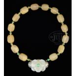 CARVED JADE AND HARD STONE NECKLACE.