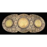UNUSUAL AND FINE CHASED AND CARVED SILVER BELT BUCKLE WITH THREE GOLD COINS.