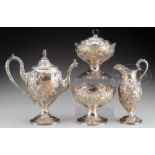 EXCEPTIONAL EARLY FOUR PIECE COIN SILVER TEA SERVICE BY S. KIRK & SON.