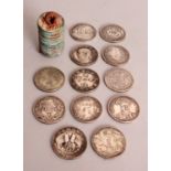 A GROUP OF TWELVE CHINESE SILVER-METAL COINS, each 1.5in diameter; together with a string of
