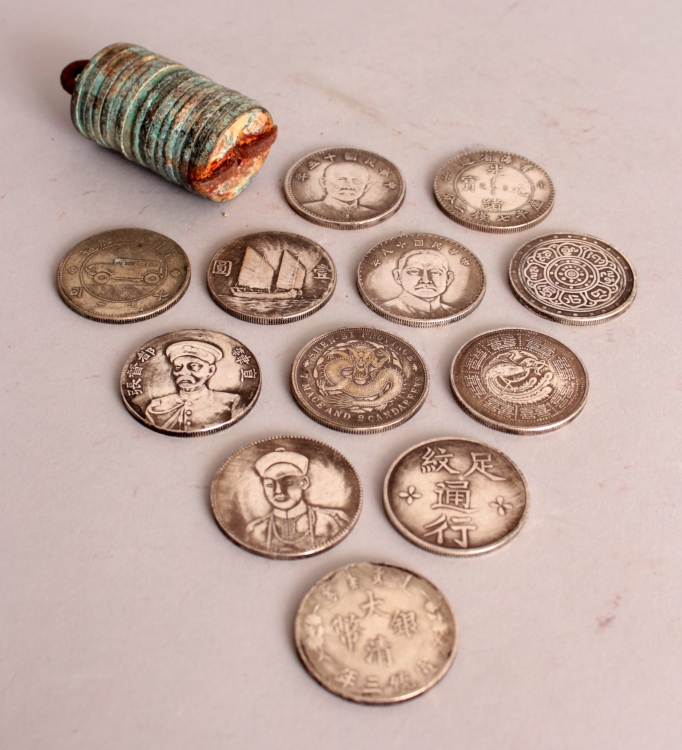 A GROUP OF TWELVE CHINESE SILVER-METAL COINS, each 1.5in diameter; together with a string of - Image 2 of 2